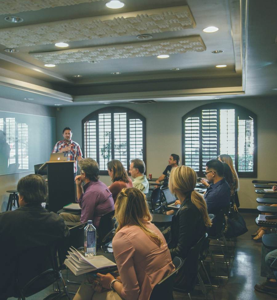 A full seminar room during a corporate training session